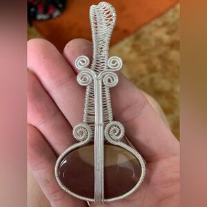 Wire wrapped guitar pendant